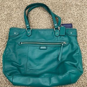 Teal Coach purse. Navy blue inside.
